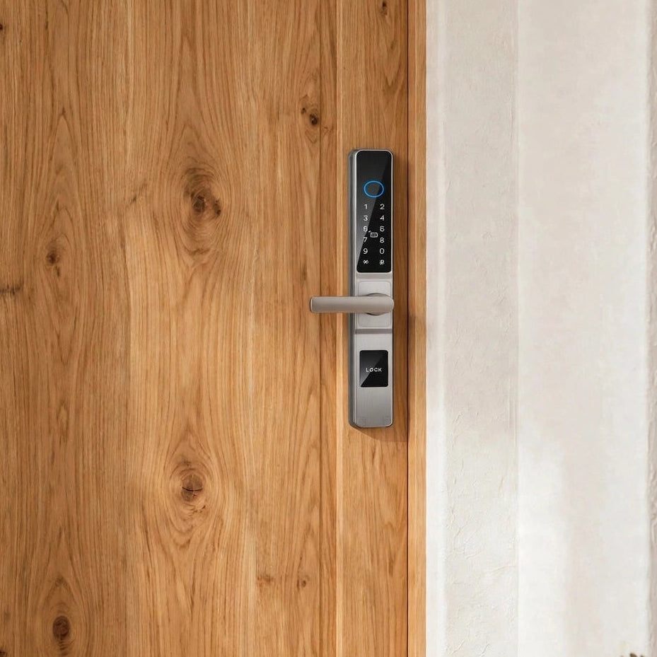 Silver smart door lock fitted to a light timber front door