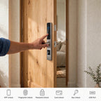 Hand pushing the silver smart door lock open, with icons for app, fingerprint, password, card, key and USB unlock